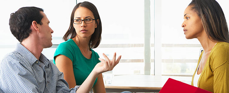 Three people having a discussion