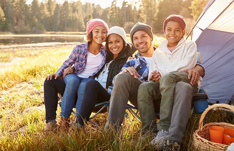 Photo of a family at a camp