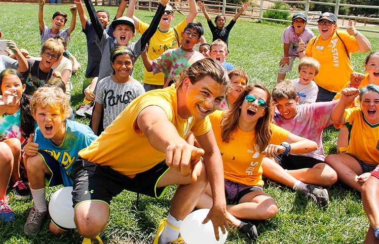 Photo of Camp Marston campers in orange shirts