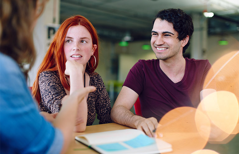 A man and a woman discussing options for a new home