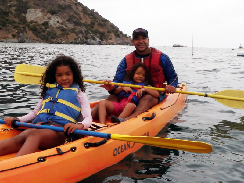 dad and daughters canoeing