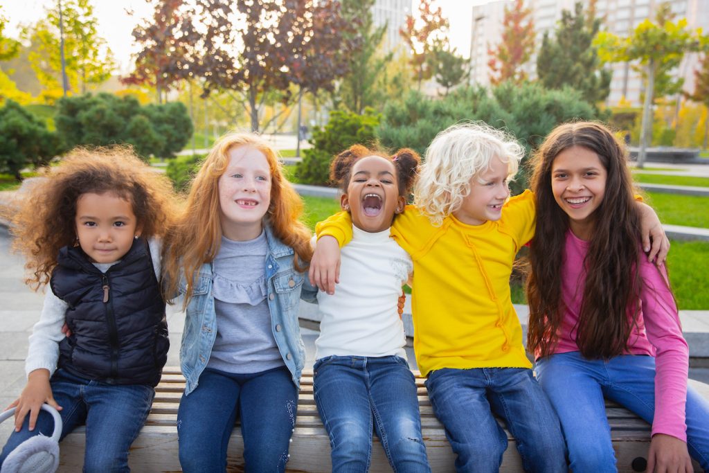 Group of kids playing at the park.