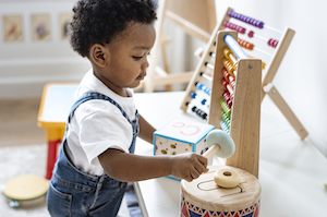 Young boy playing with educational toys