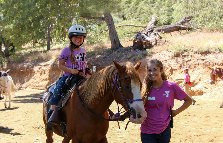 Photo of a camper on a horse at Raintree Ranch