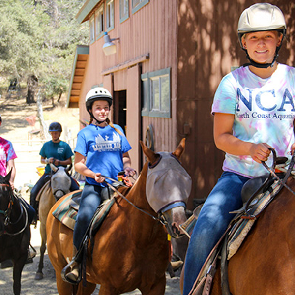 girls riding horse