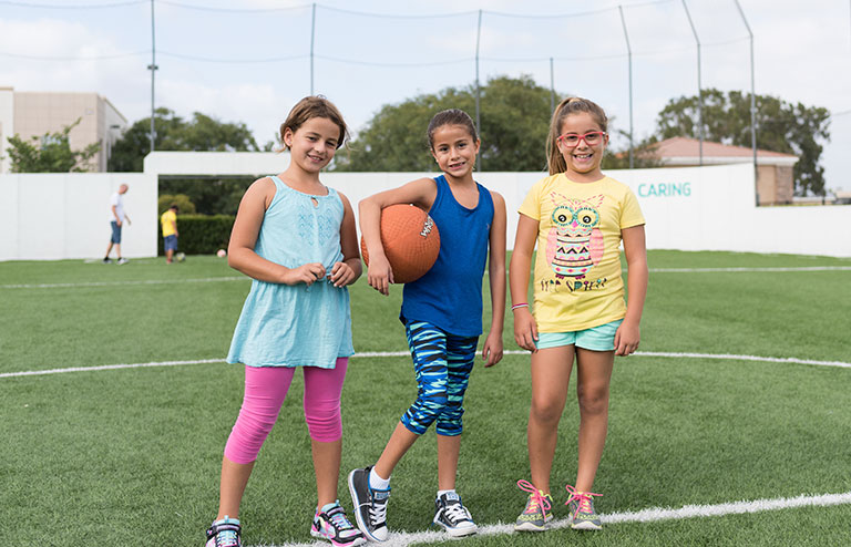 Photo of three young female members of the YMCA