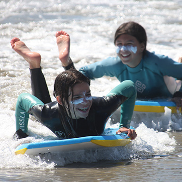 smiling girl surfing