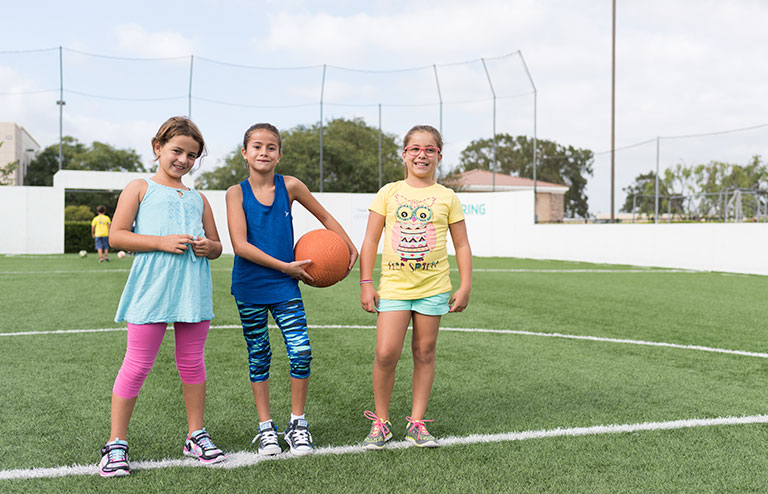 Photo of three young female members of the YMCA