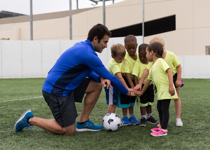 Soccer coach with a peewee soccer team