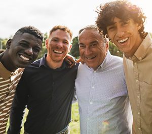 a group of men smiling