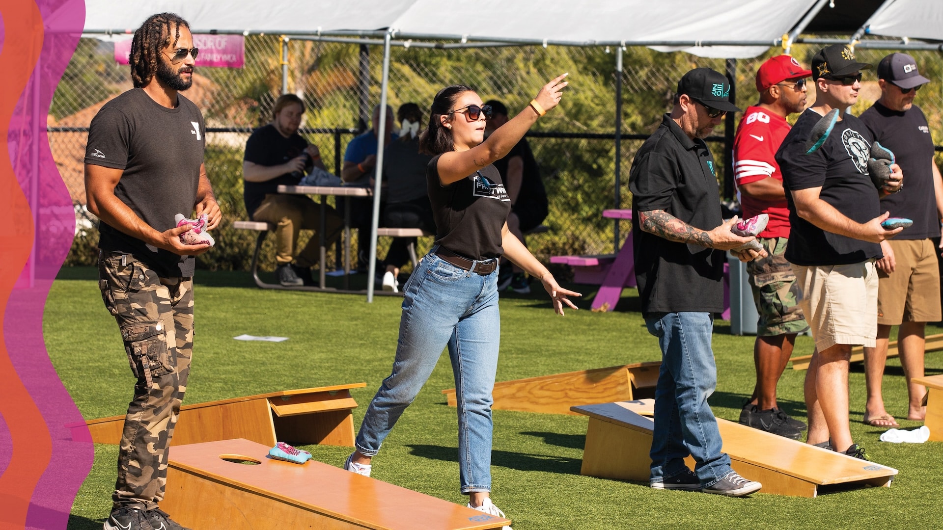 group playing cornhole