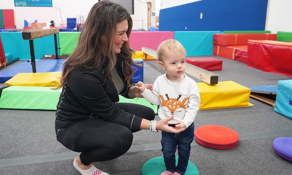 mom and child in gymnastics class