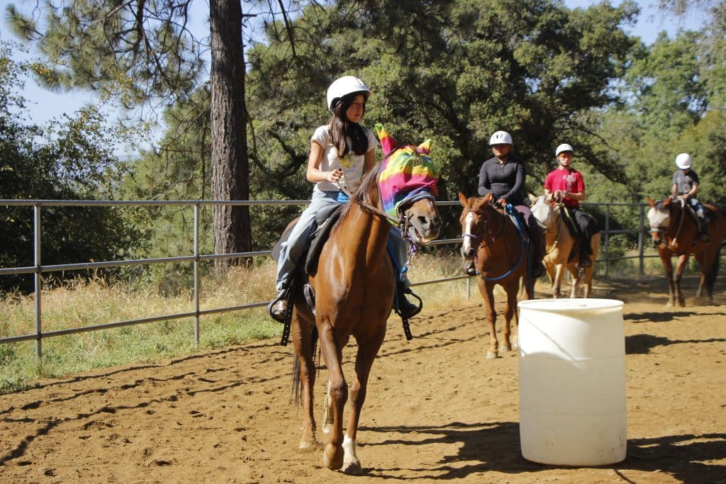 Camper riding horse
