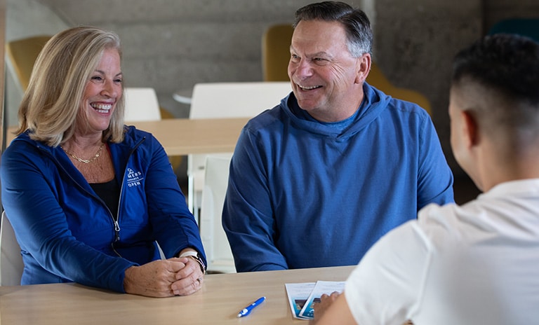 couple talking to staff